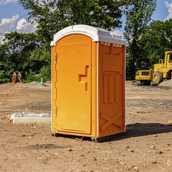 what is the cost difference between standard and deluxe portable restroom rentals in Mustang TX